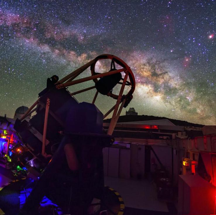 The Liverpool Telescope shown at night with the milky way in the sky above it