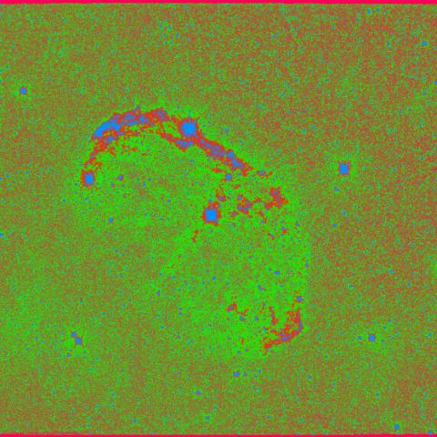 A false-colour green and dark red image of a supernova remnant